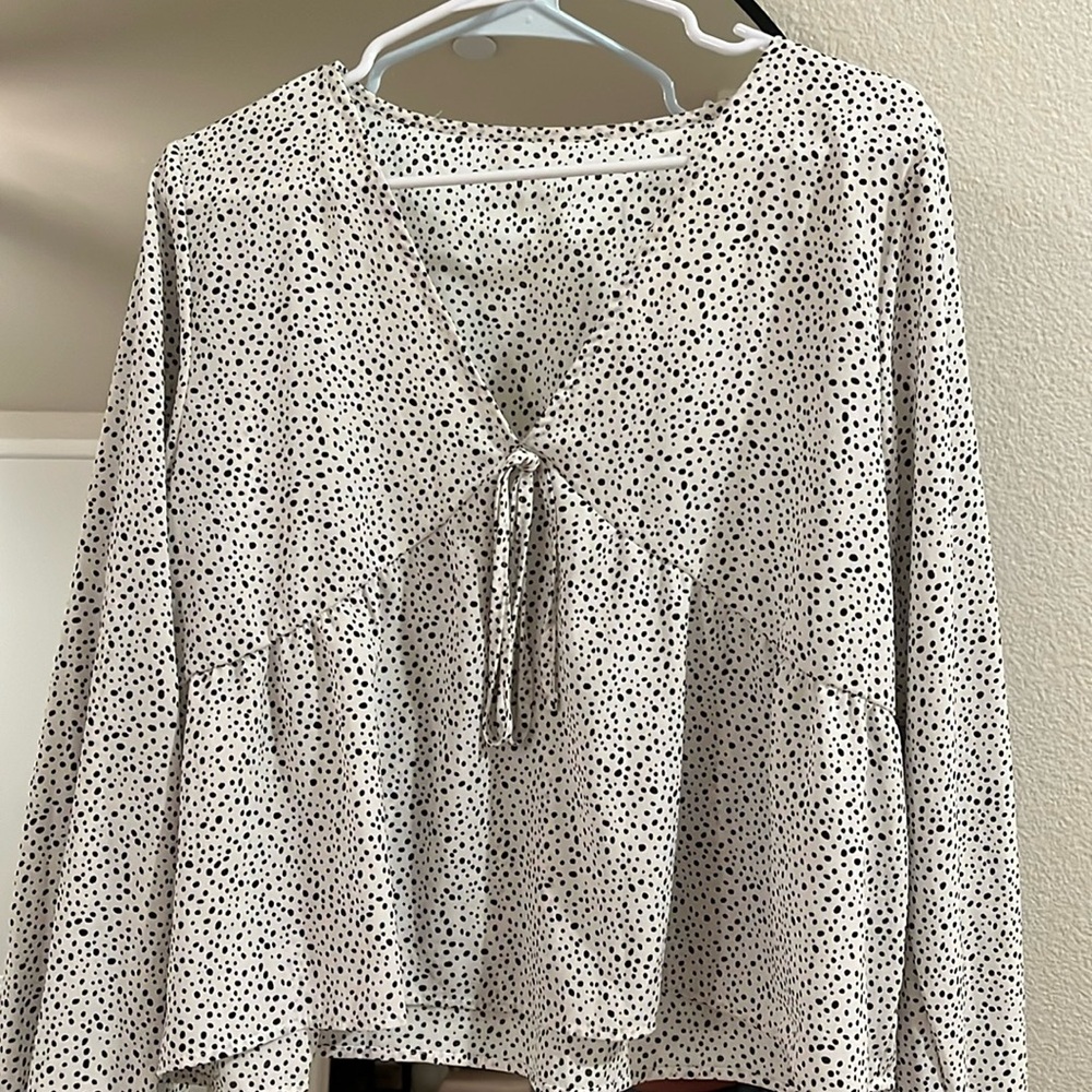 Black and white Dalmatian print long sleeve top.